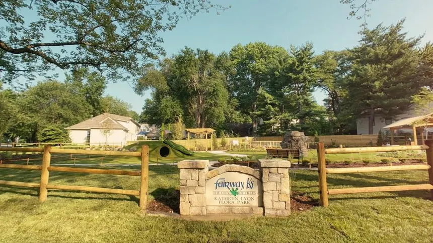Stone "Fairway, KS - The City of Trees" sign at the entrance to Kathryn Lyon Flora Park