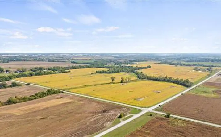 Aerial view of farm fields and a rural crossroads on the open ground around Edgerton, Kansas