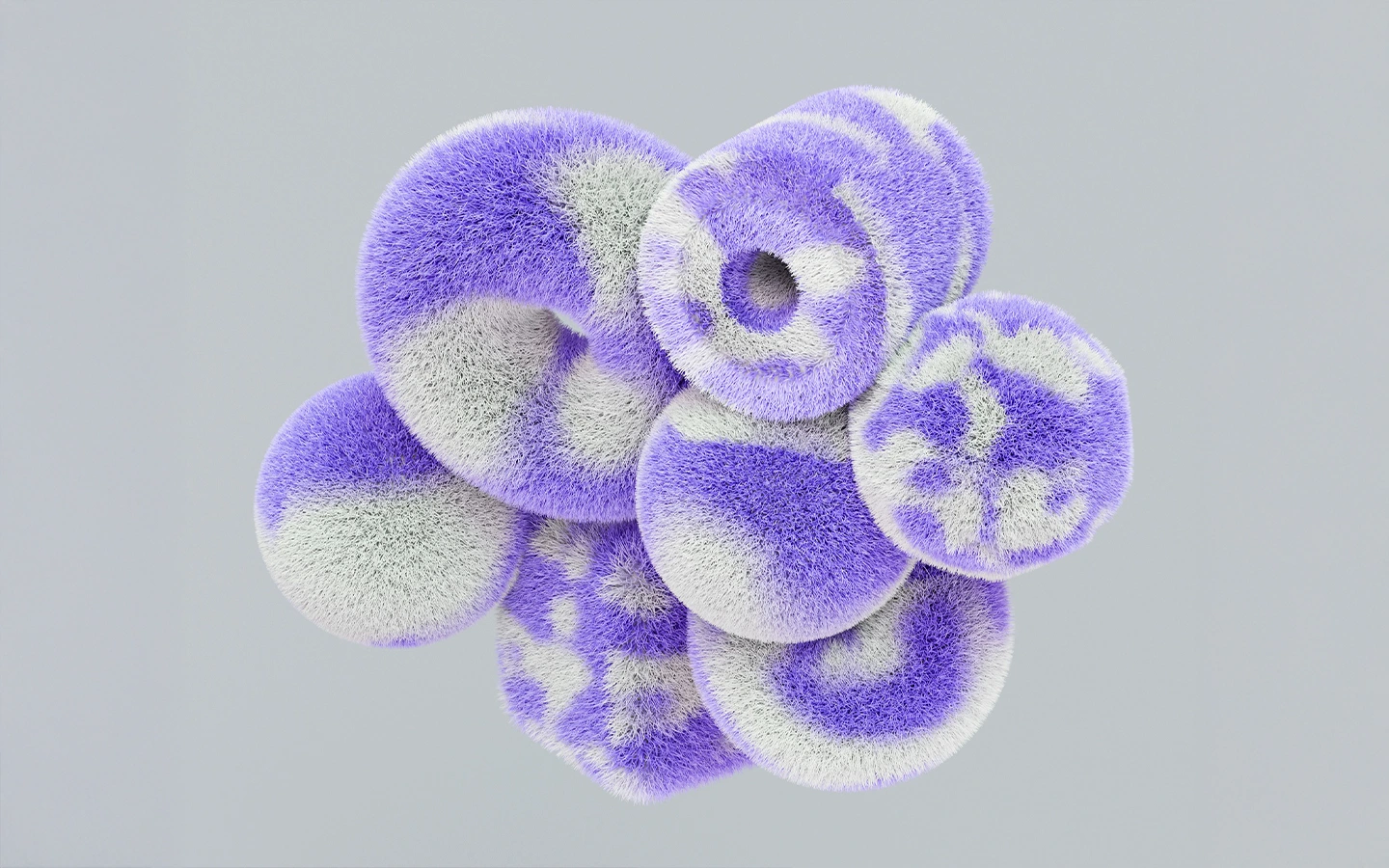 Cluster of fuzzy, round, donut-shaped objects in purple and white on a gray background.