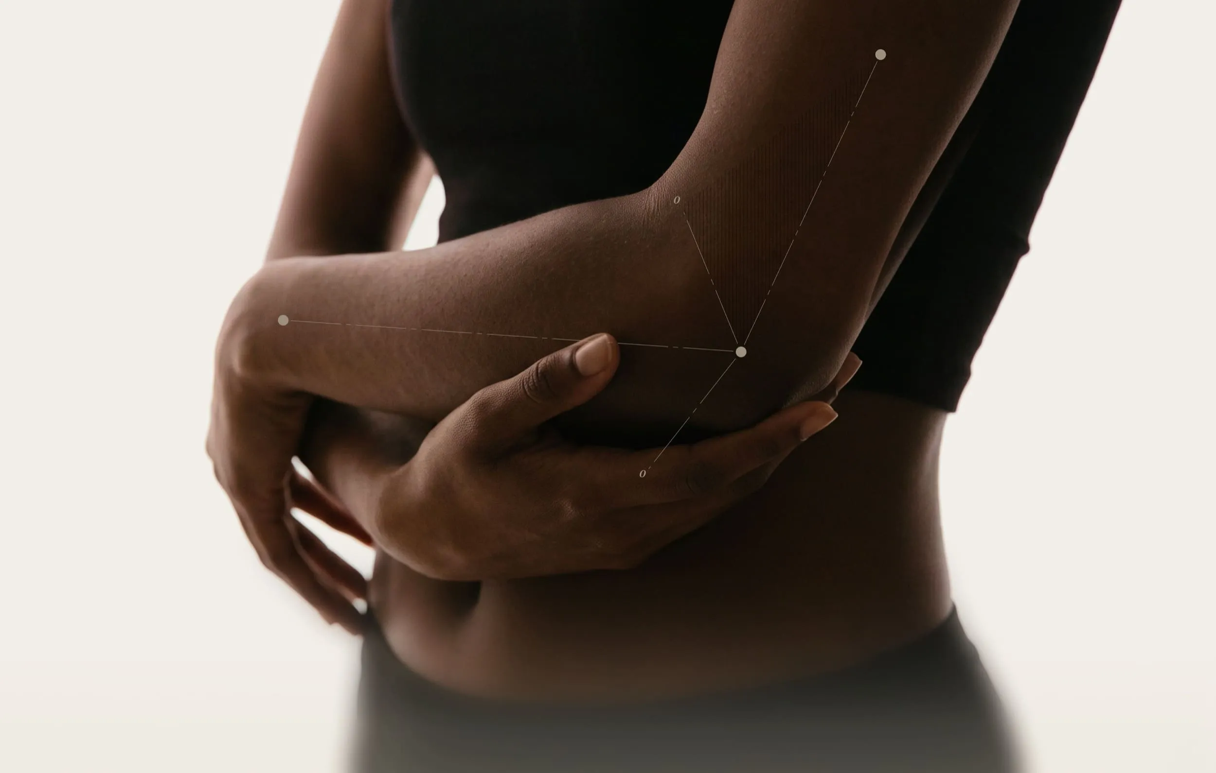 Person hugging opposite arm to show elbow flexion angle