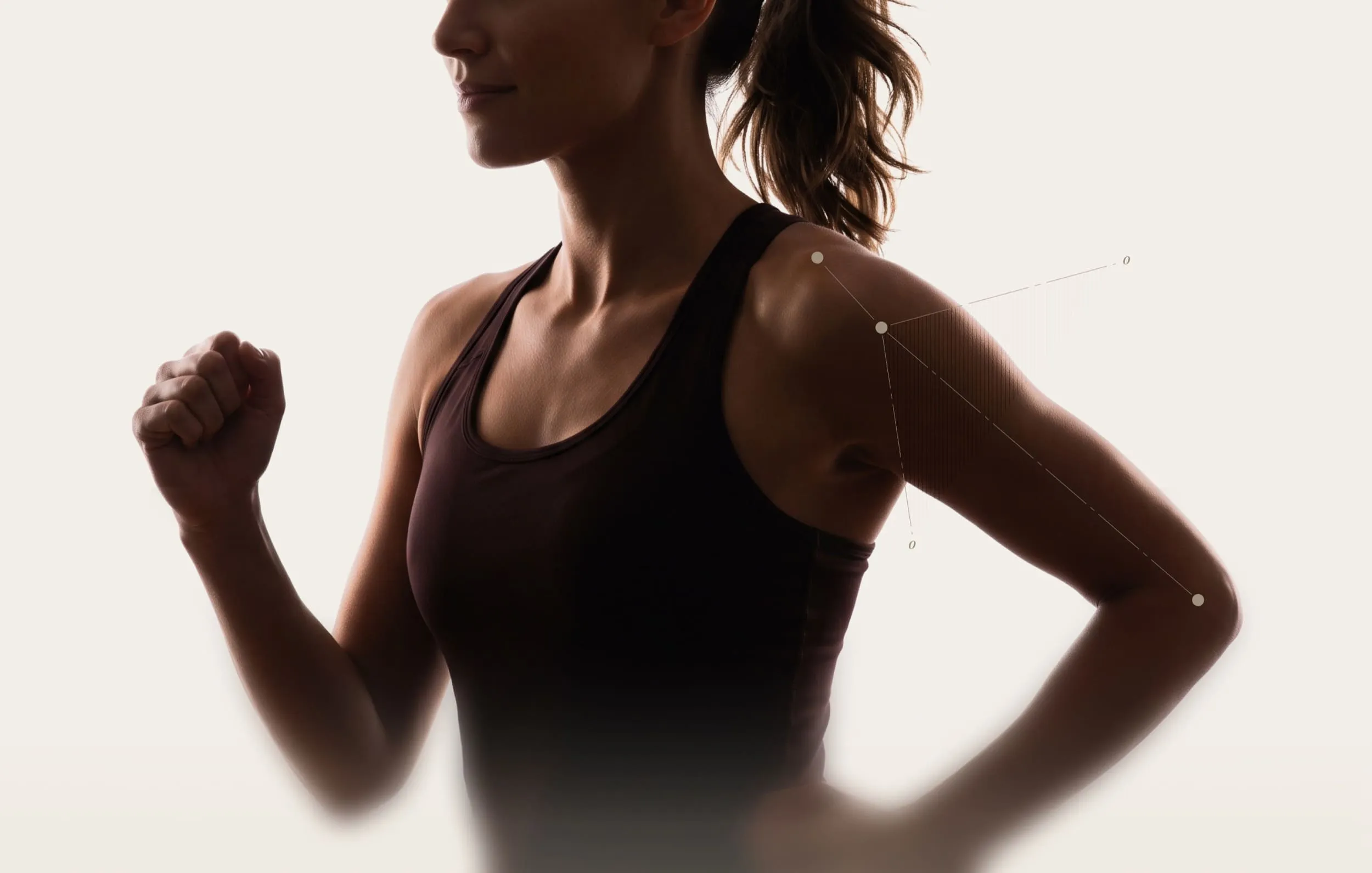 Profile of woman running showing shoulder biomechanics