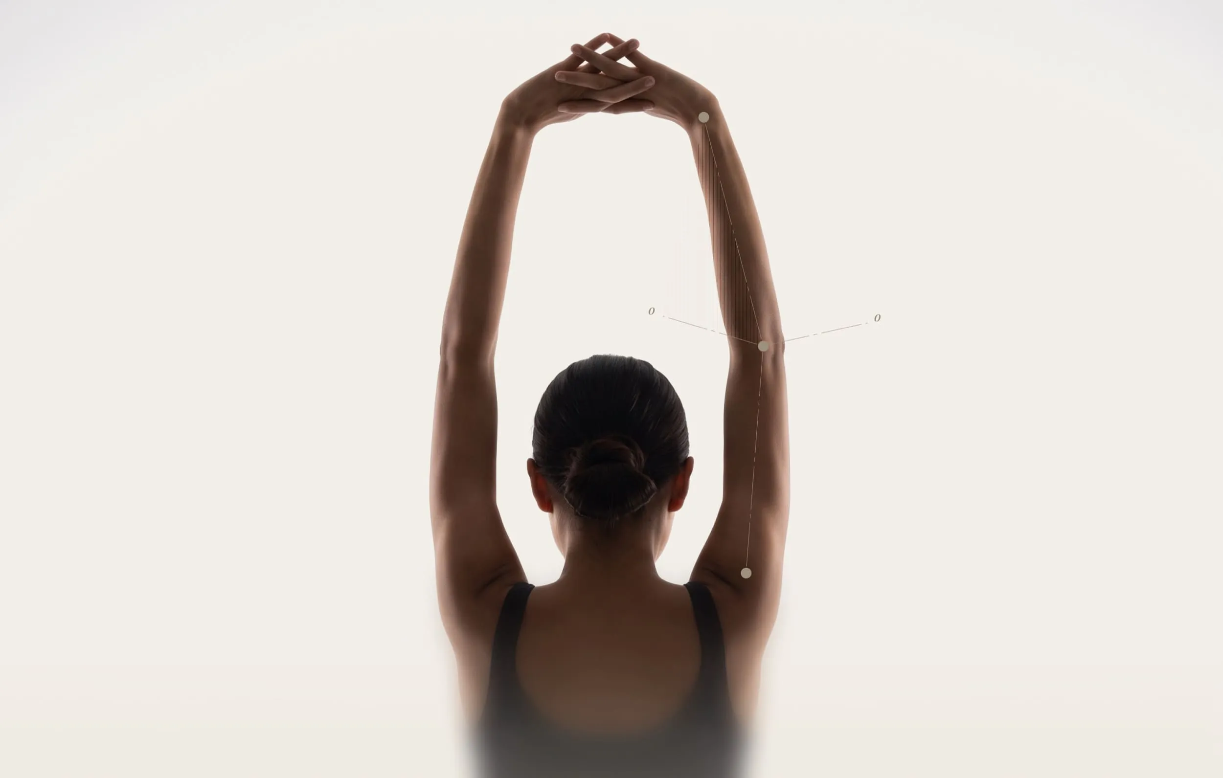 Person with arms extended overhead showing elbow extension