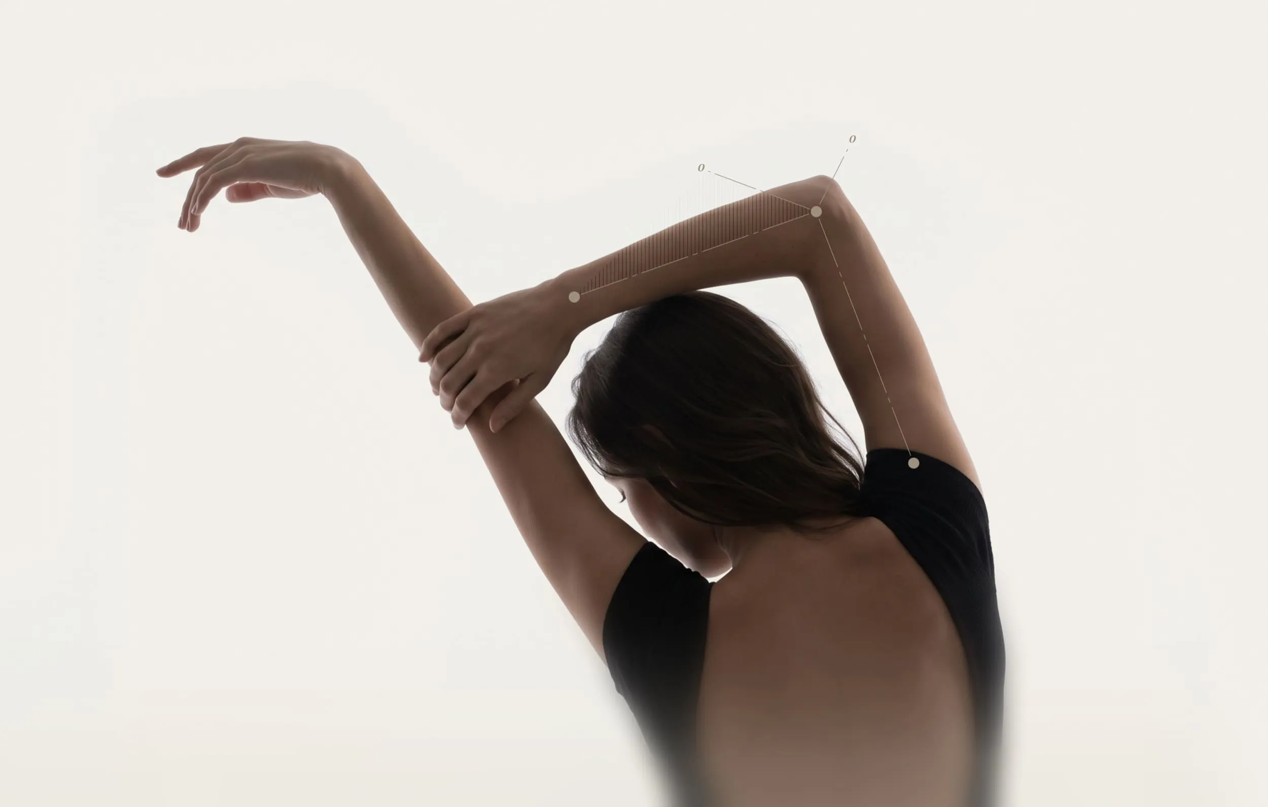 Person viewed from behind stretching both elbows overhead