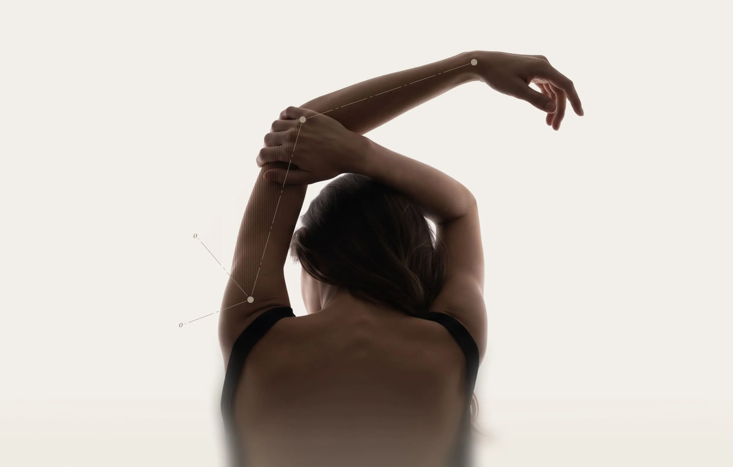 Woman from behind with crossed arms showing shoulder flexibility