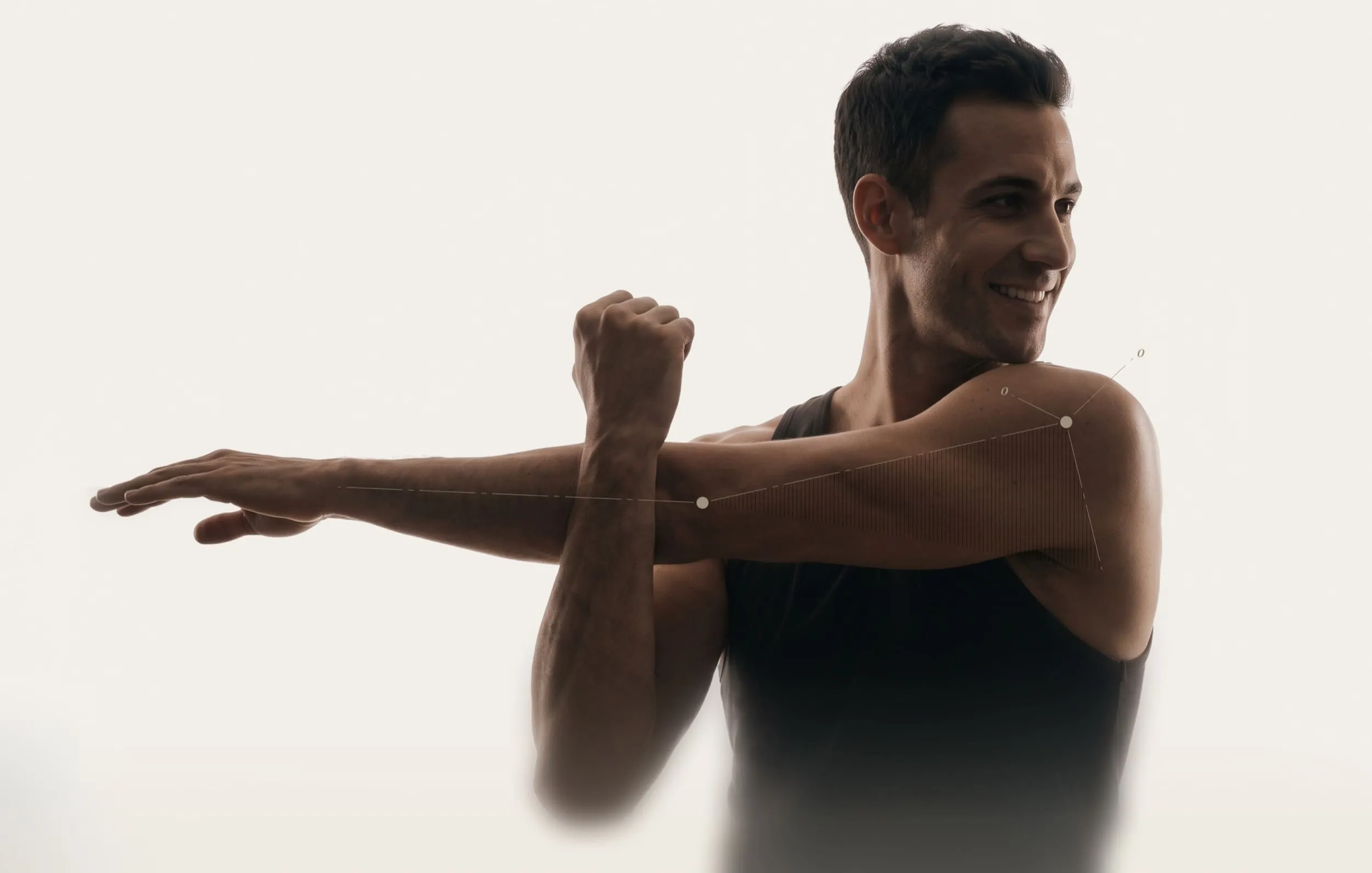 Man stretching arm across body showing shoulder joint mobility