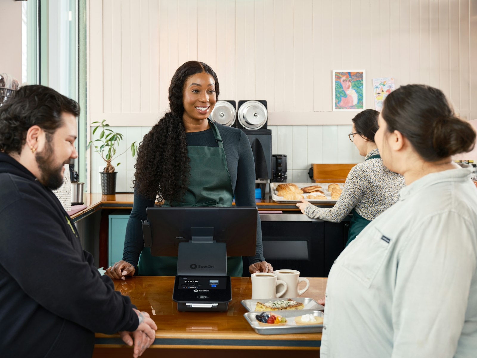 Cafe team serving customers at the counter