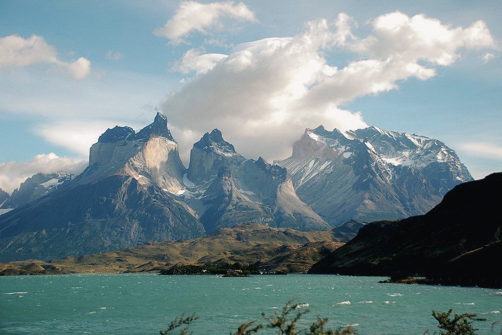 Trekkers beneath the granite towers of Torres del Paine, Patagonia