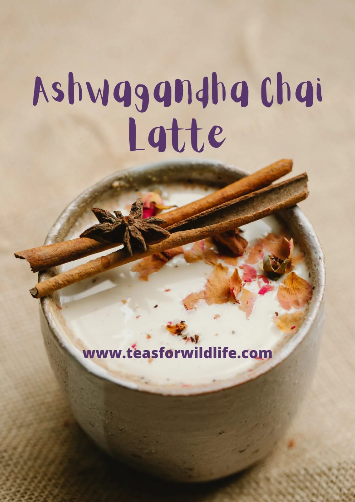Creamy chai latte in a stone mug topped with rose petals, cinnamon sticks and star anise, labelled Ashwagandha Chai Latte