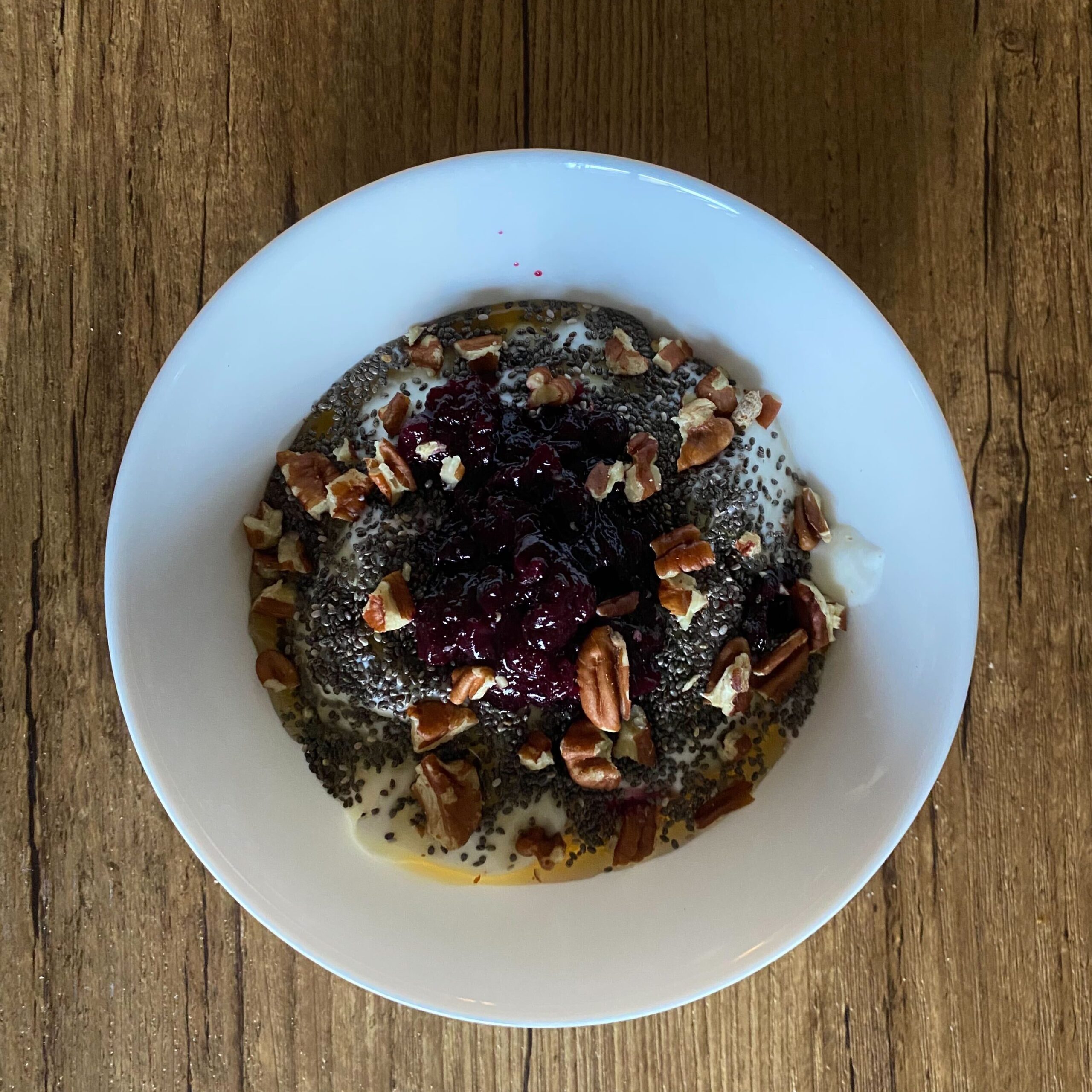 Greek yogurt bowl with blueberries, chia seeds and pecans