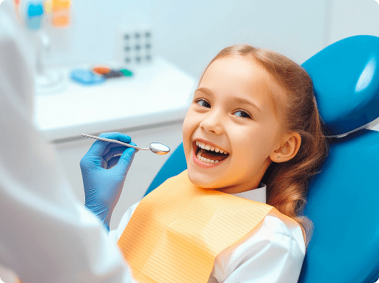Smiling man sitting in a dental chair giving a thumbs-up in a bright dental office.