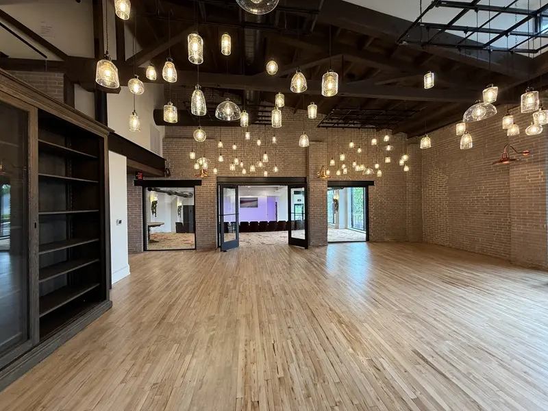 Original brick, maple floors, and hand-carved trusses in the main hall