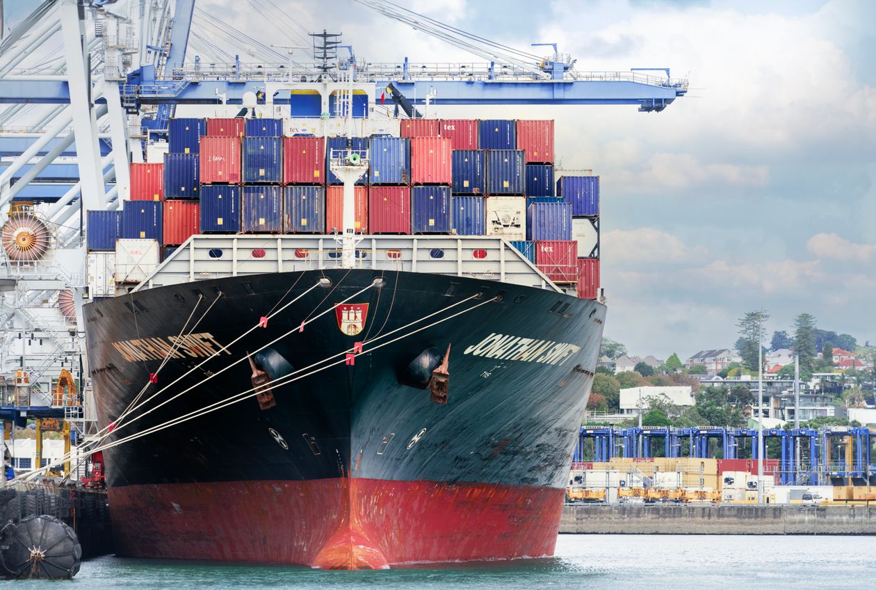 Cargo ship with containers on deck in port