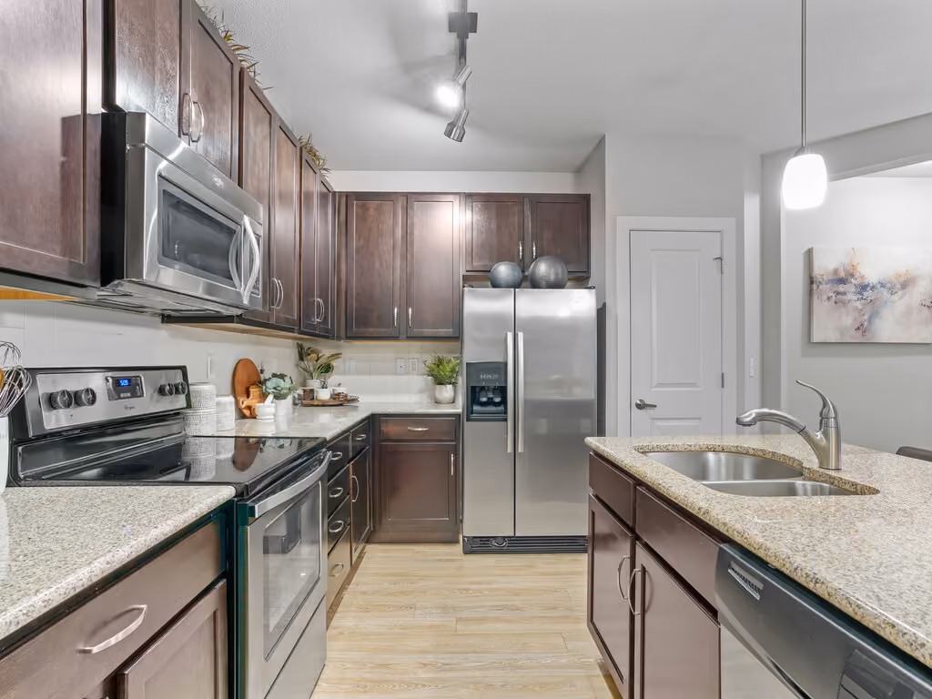 Kitchen with wood cabinets and stainless steel appliances