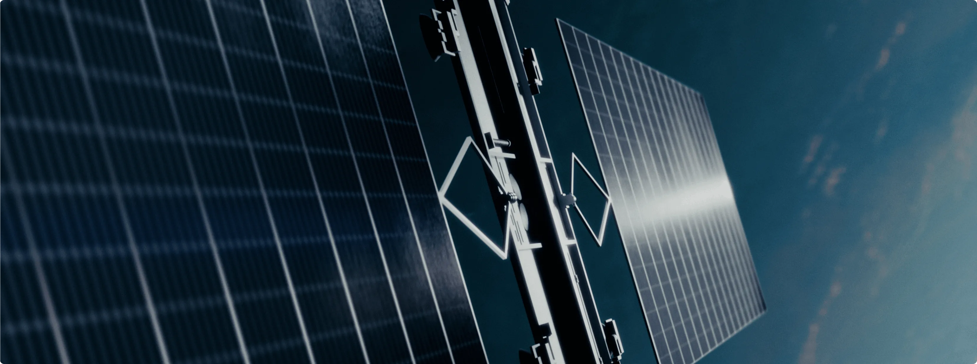 Close-up of solar panels with metallic frame under sunlight against blue sky.