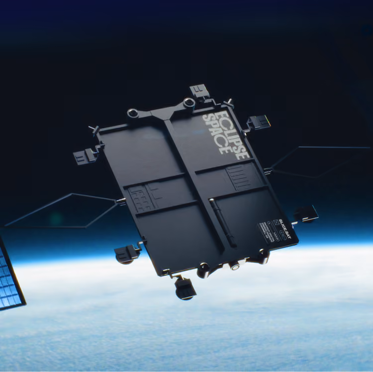 Black rectangular satellite labeled Eclipse Space orbiting above Earth's atmosphere with solar panels visible.