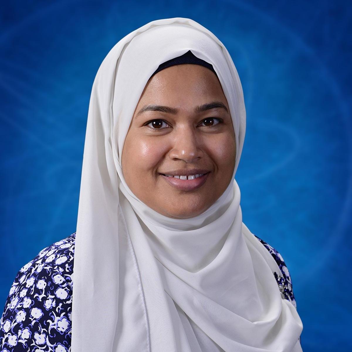 Tania Hasnat smiling in a professional staff headshot photo