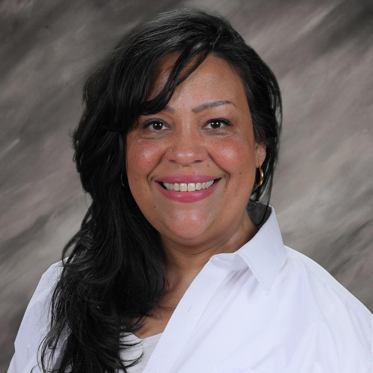 Julie Velez smiling in a professional staff portrait photo