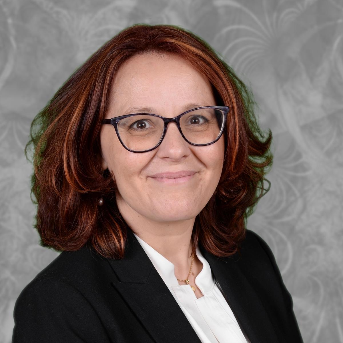Laura Antunez smiling in professional staff headshot photo