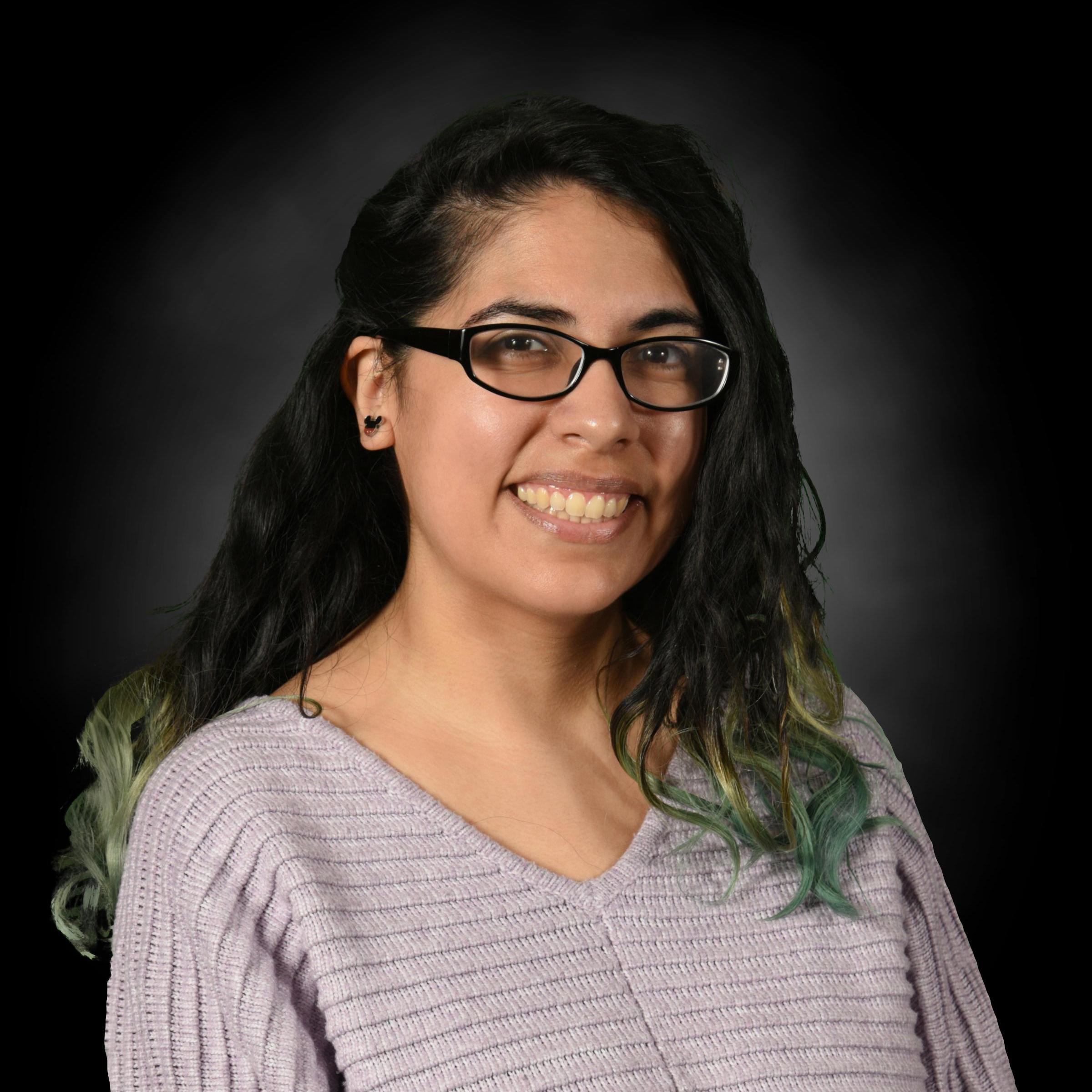Vanessa Herrera smiling in staff directory portrait photo