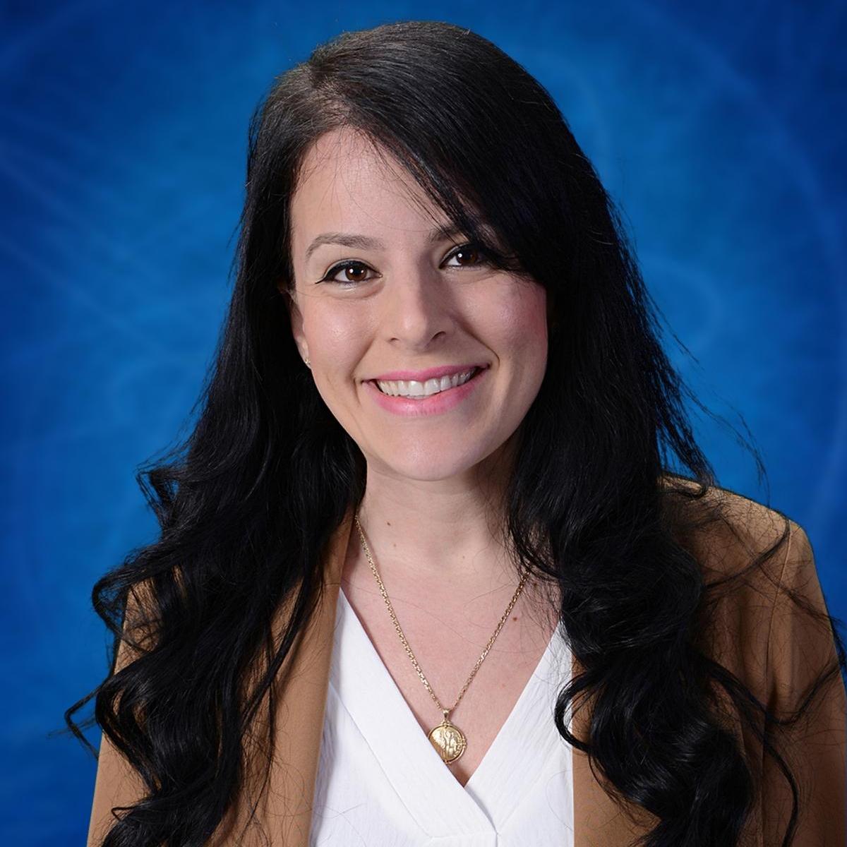 Elpida Diamantatos smiling in a professional staff portrait