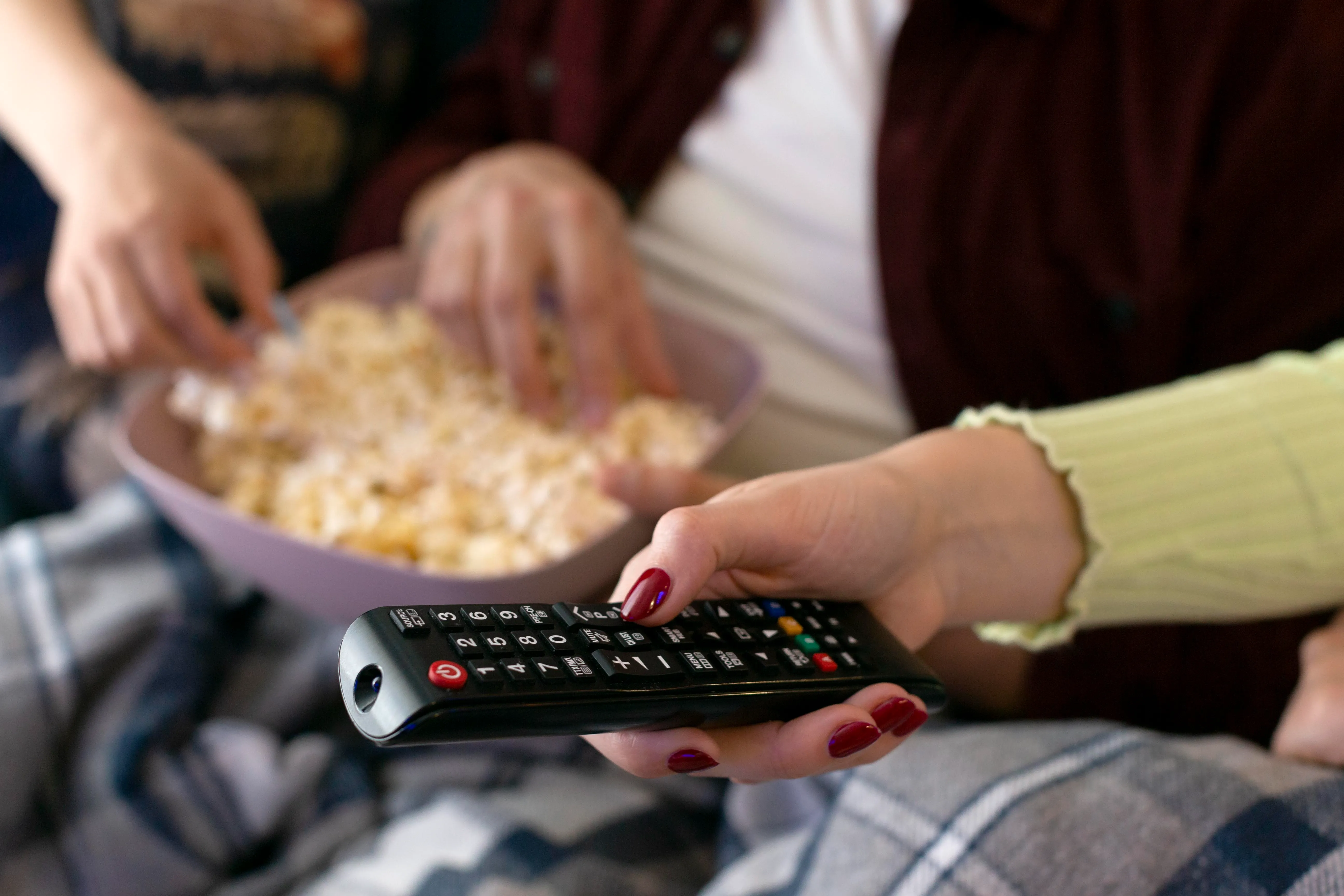 hand holding remote