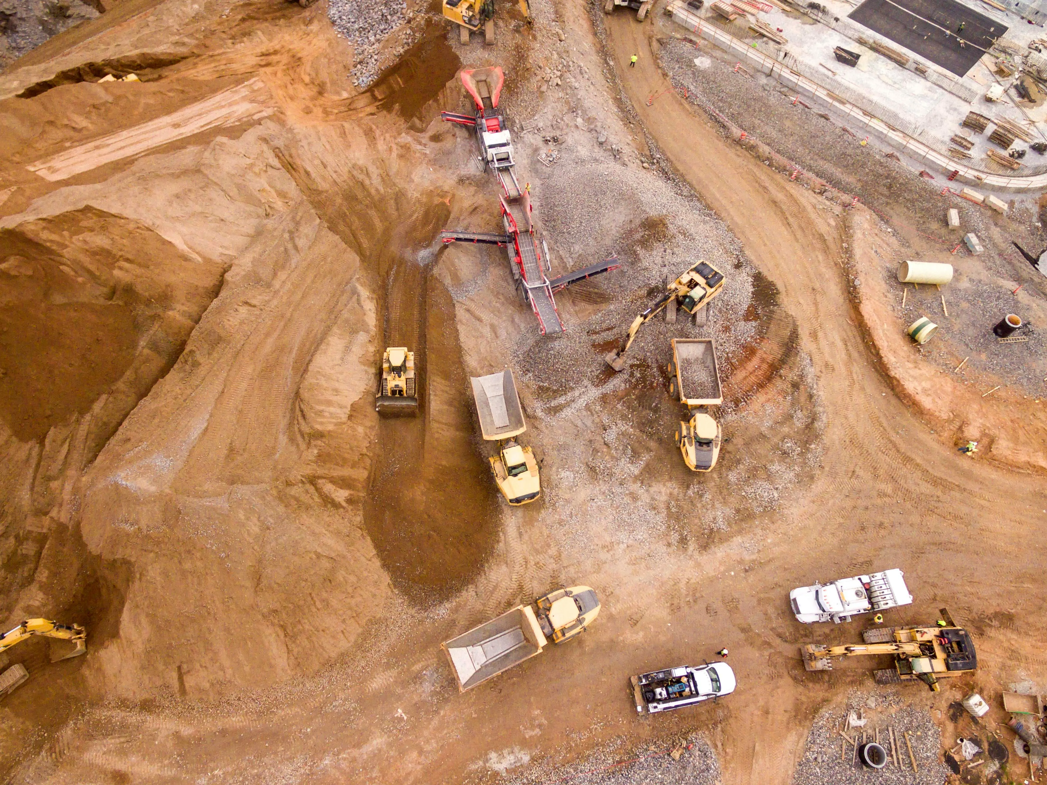 Aerial view of a mining site with haul trucks