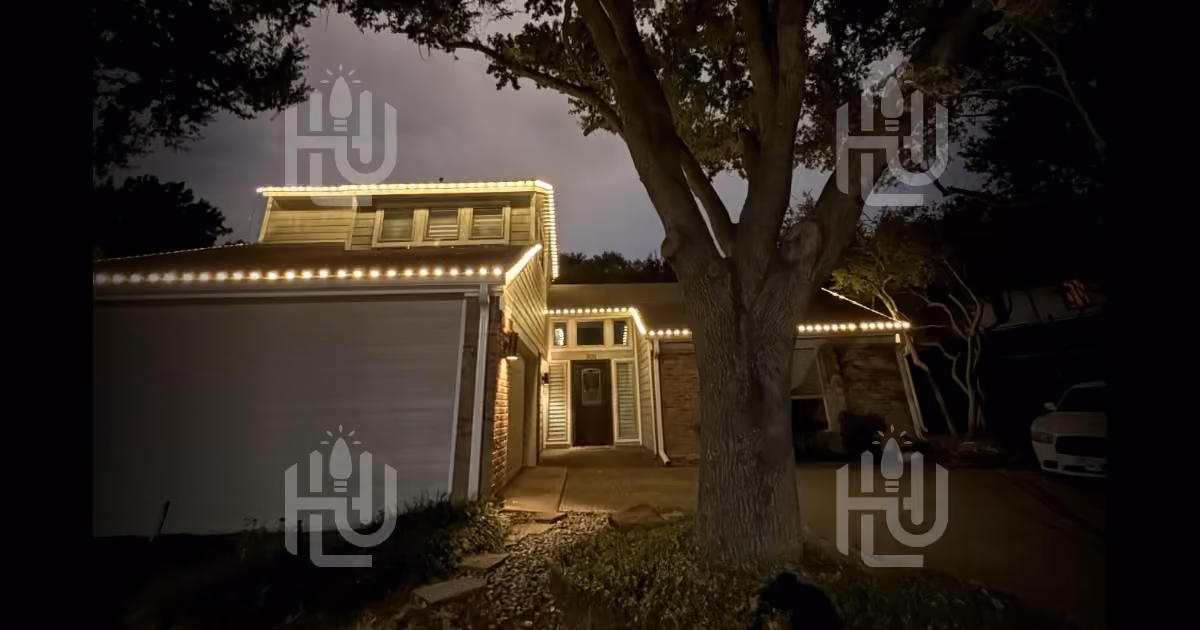 White C9 Christmas light installation on a residential roofline