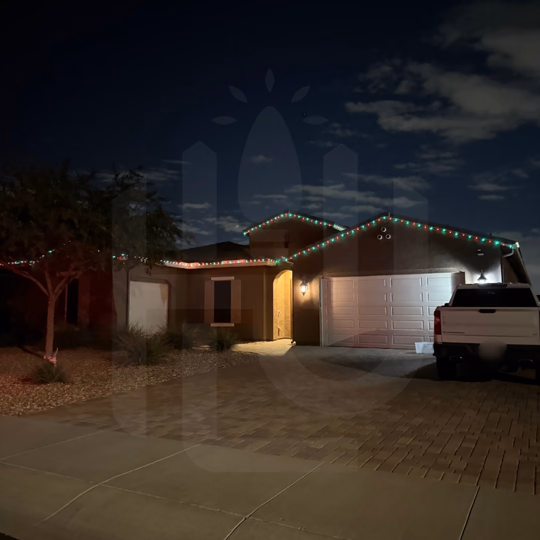 Professional outdoor holiday lighting installation on a suburban home