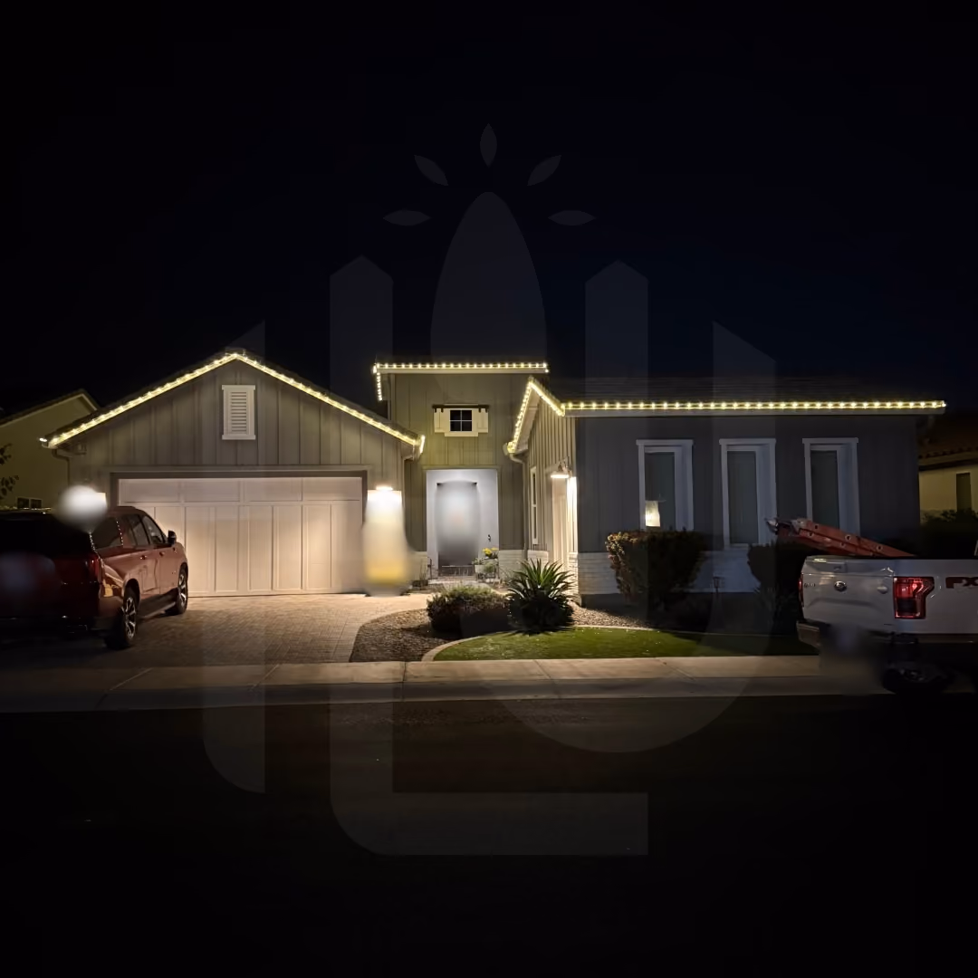 Residential holiday lighting installation featuring white C9 roofline lights