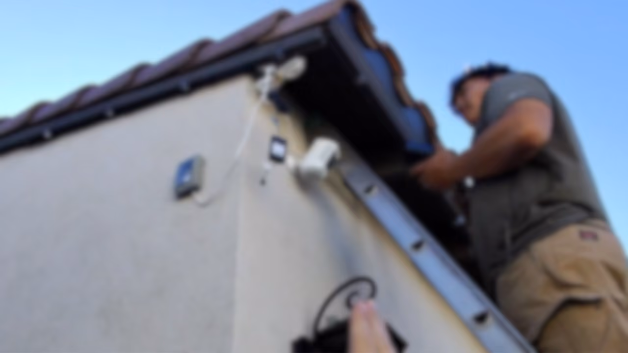professional christmas light installers installing c9s on a residential job