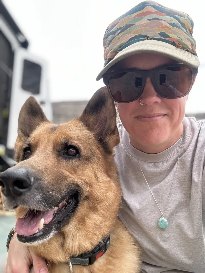 Nicki Polen, founder of Pixel Pusher Designs, with her German Shepherd