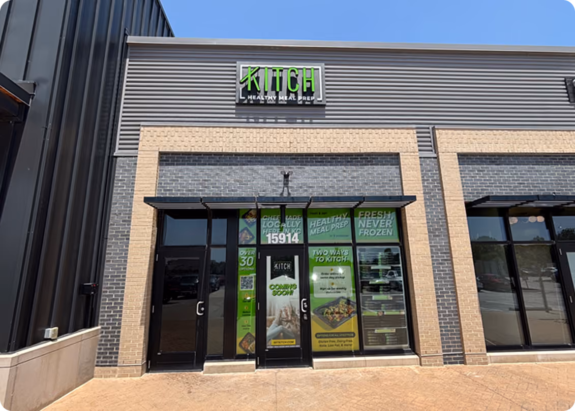 Storefront of Kitch Healthy Meal Prep with green signage