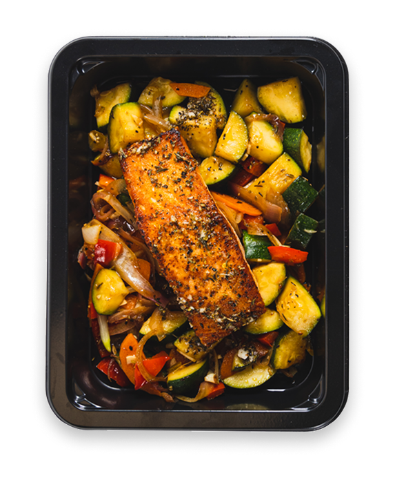 Grilled seasoned salmon fillet on a bed of sautéed mixed vegetables in a black tray.