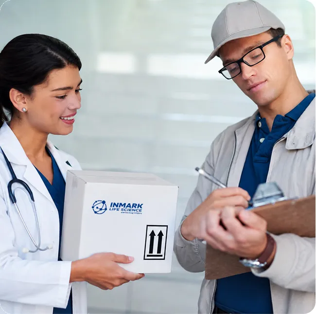 Clinician handing a Saf-T-Pak shipping box to a courier signing for delivery