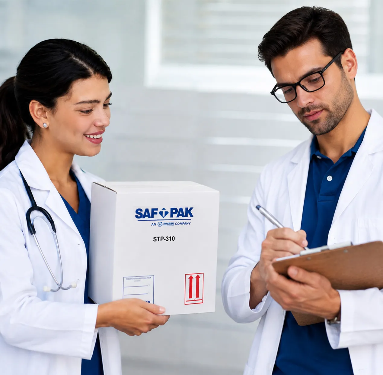 Clinician handing a Saf-T-Pak shipping box to a courier signing for delivery