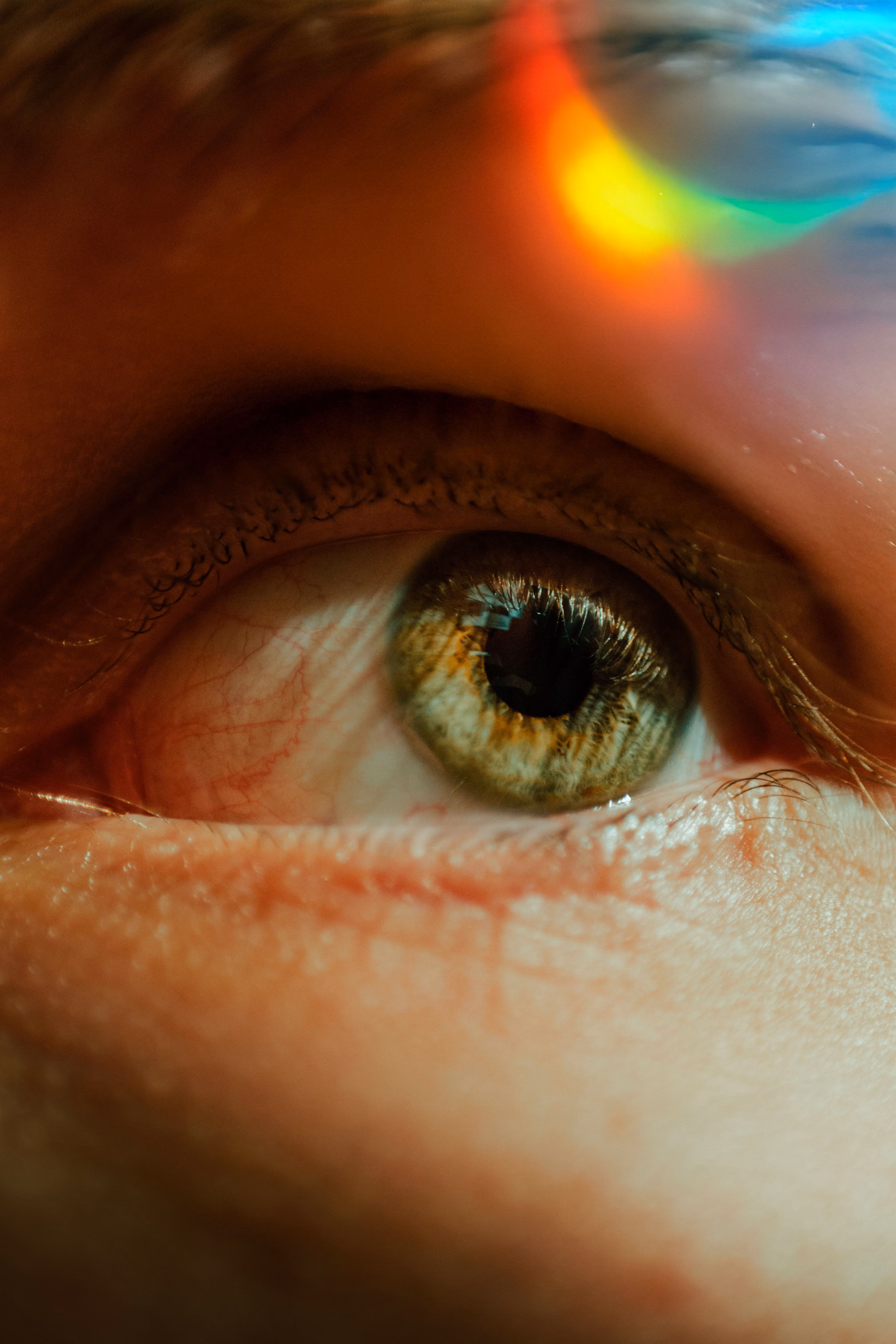 picture of eye close up with rainbow reflection