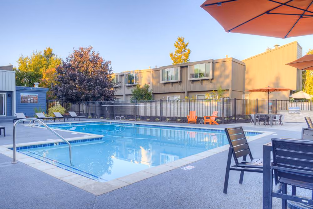 Swimming pool with lounge chairs and tables