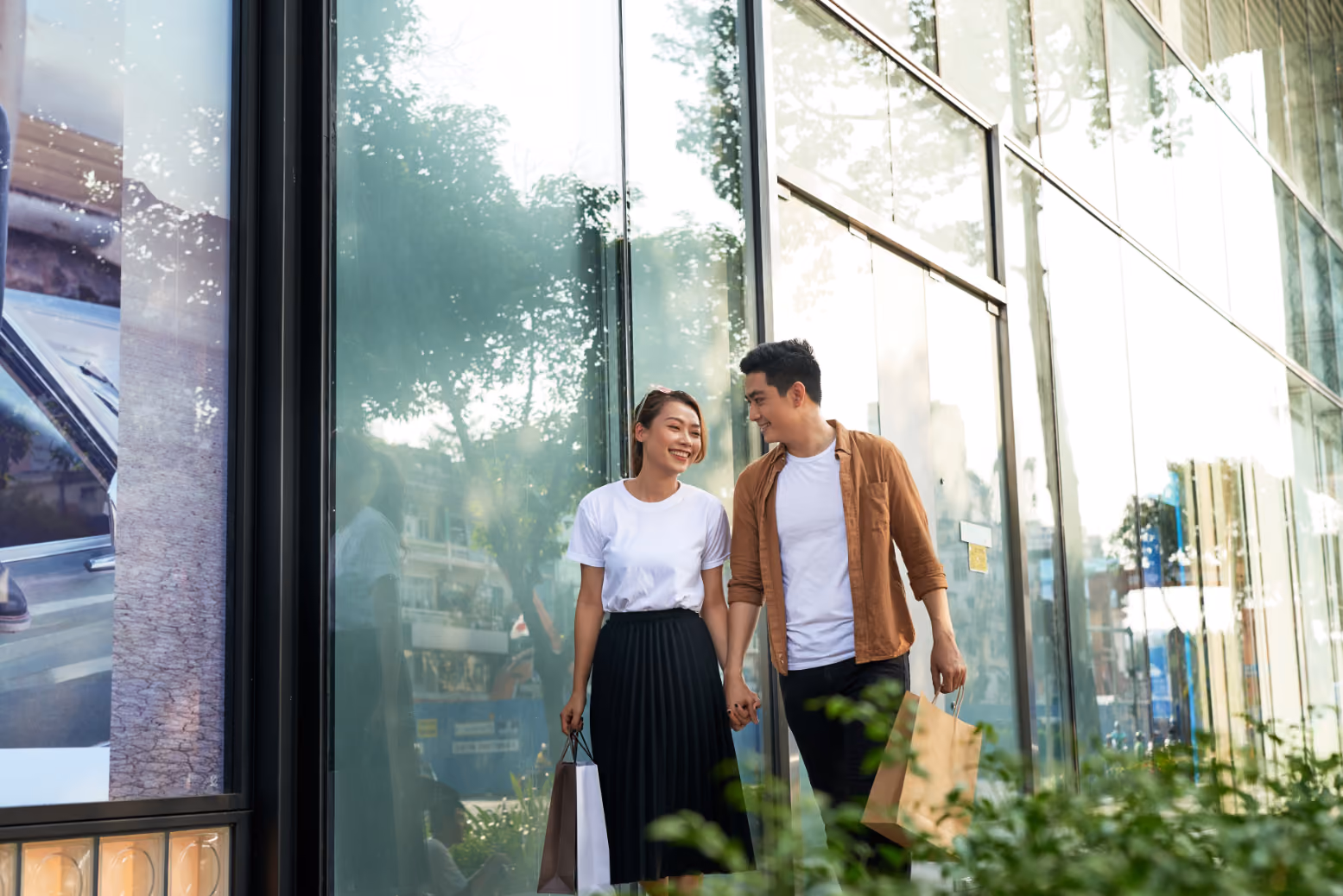 Couple walking with shopping bags