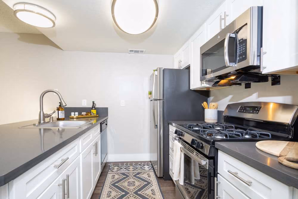 Kitchen with white cabinets and stainless steel appliances