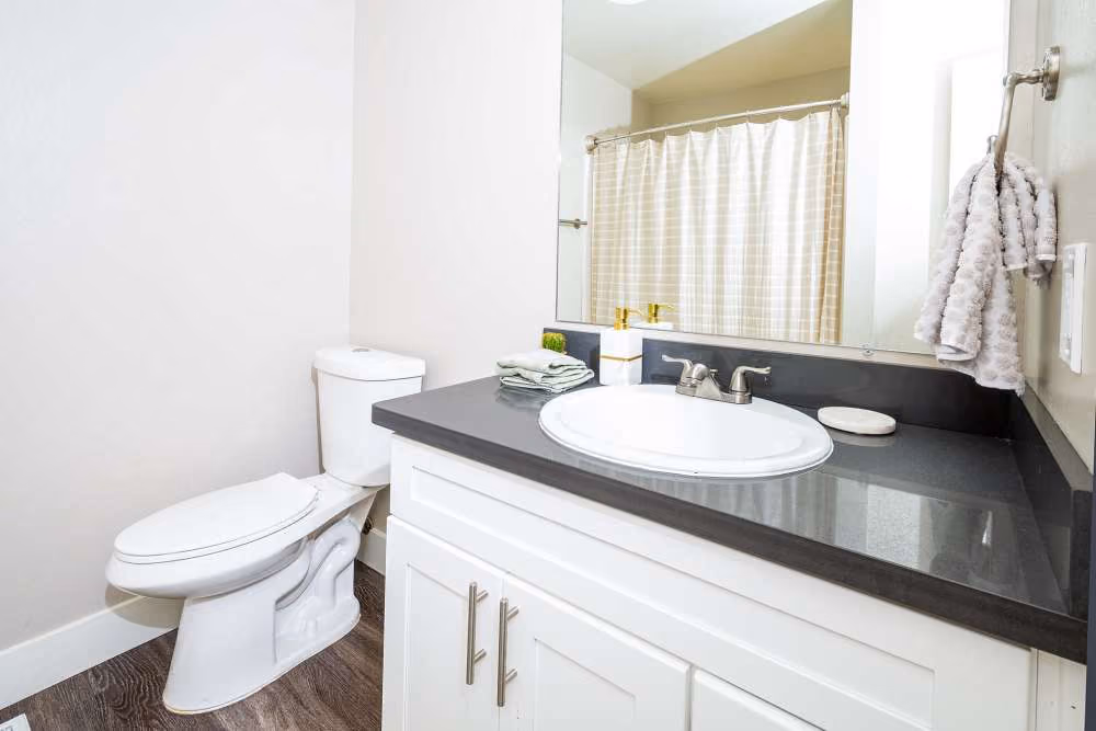 Bathroom with white cabinets and vanity