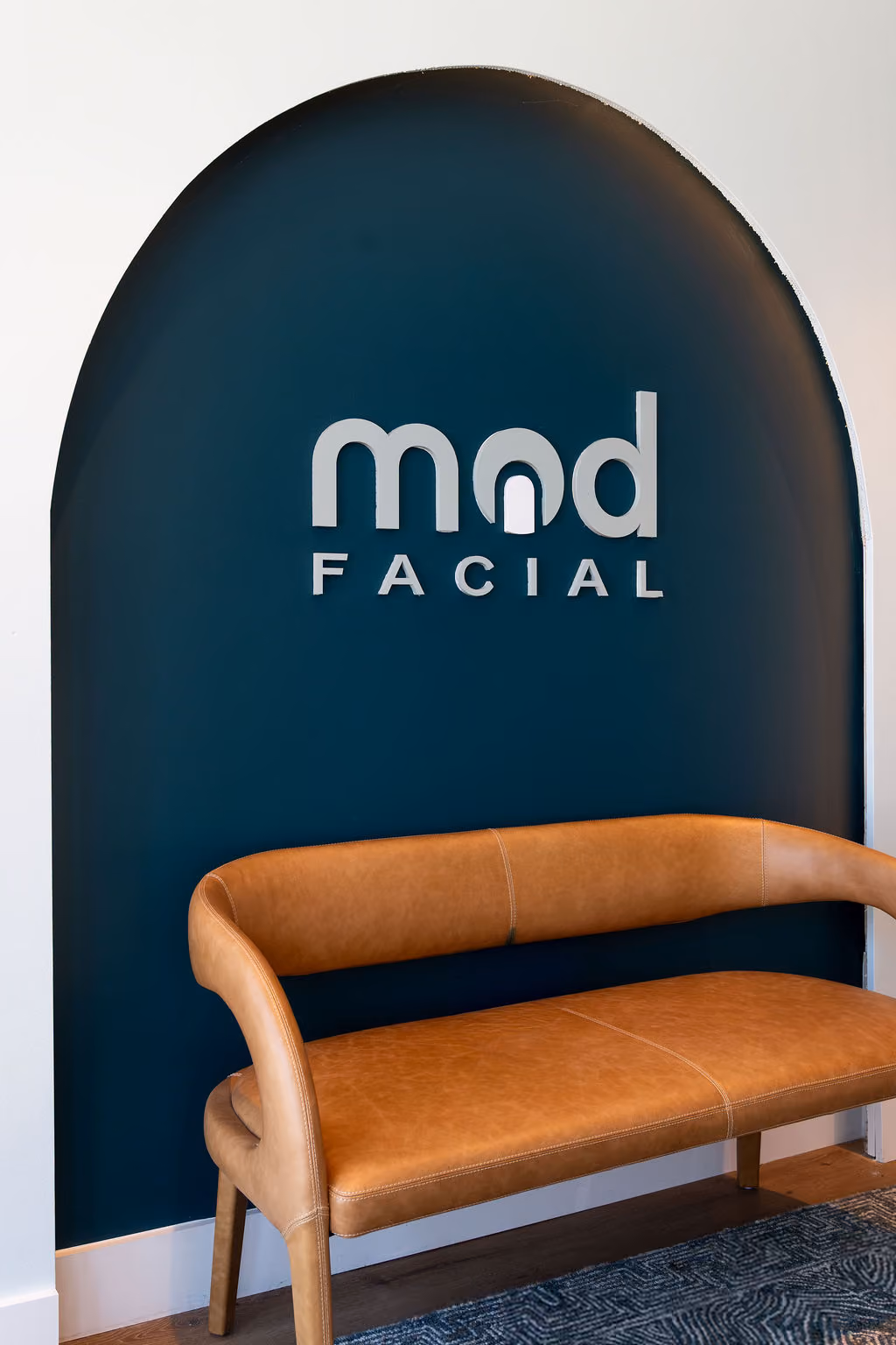 Happy client after a glow ritual facial