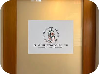 Sign for Grace Integrative Wellness with a floral logo and Dr. Kristine Troesch's name and credentials.