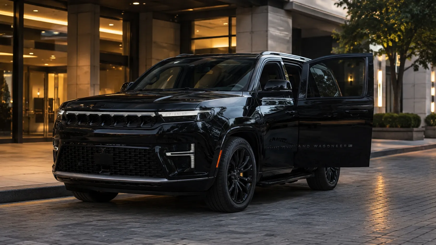 RM Executive's Black Jeep Grand Wagoneer SUV parked with front passenger door open at dusk near building entrance.