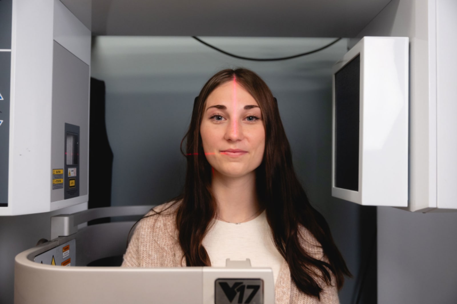 Woman at reception desk preparing paperwork for first appointment