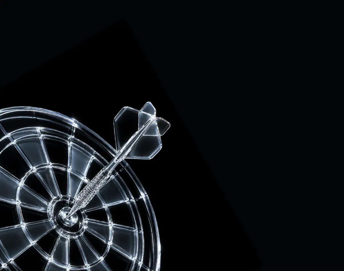 Transparent dart hitting the bullseye on a transparent dartboard against black background.