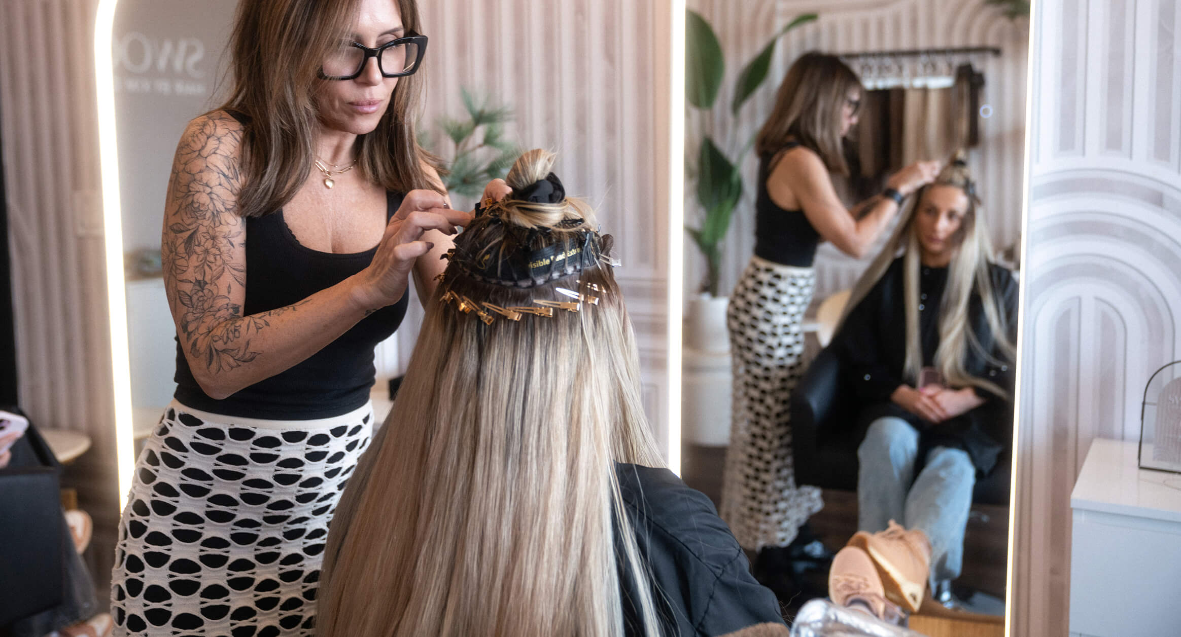 Close-up of an Invisible Bead Extensions® installation showing concealed beaded rows for a seamless, natural-looking finish.