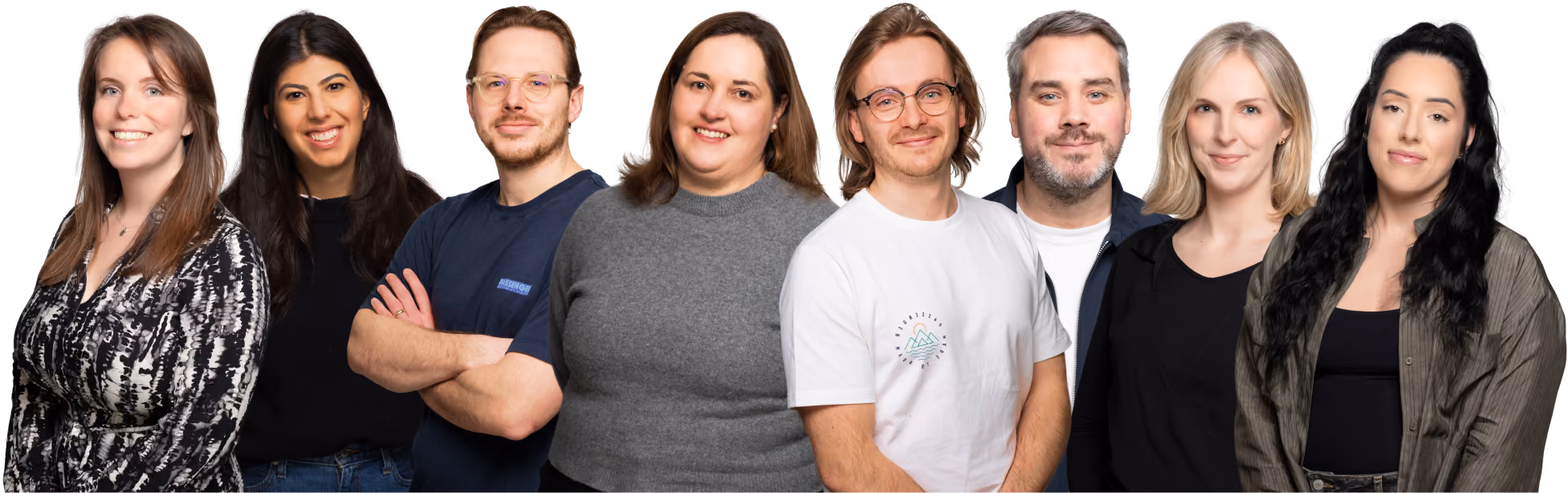 Group of four diverse adults smiling and posing side by side in casual attire on transparent background.