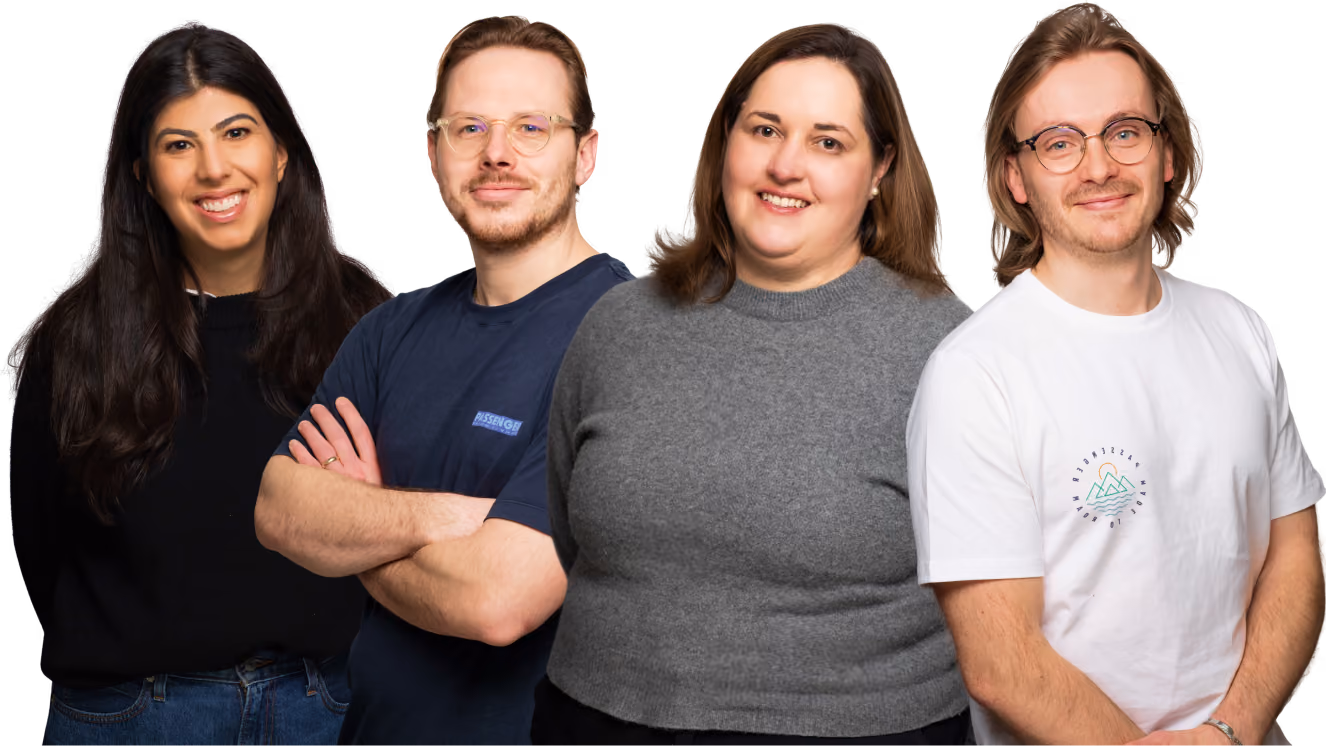 Group of four diverse adults smiling and posing side by side in casual attire on transparent background.