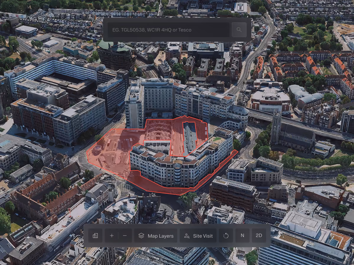 3D aerial view of an urban area with a building complex highlighted in red and map interface controls.