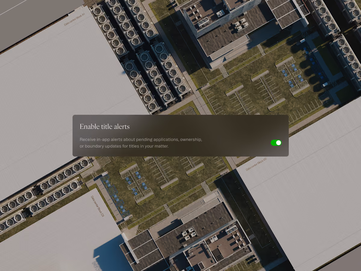 Toggle switch enabled for title alerts over an aerial view of data center buildings and parking lots.